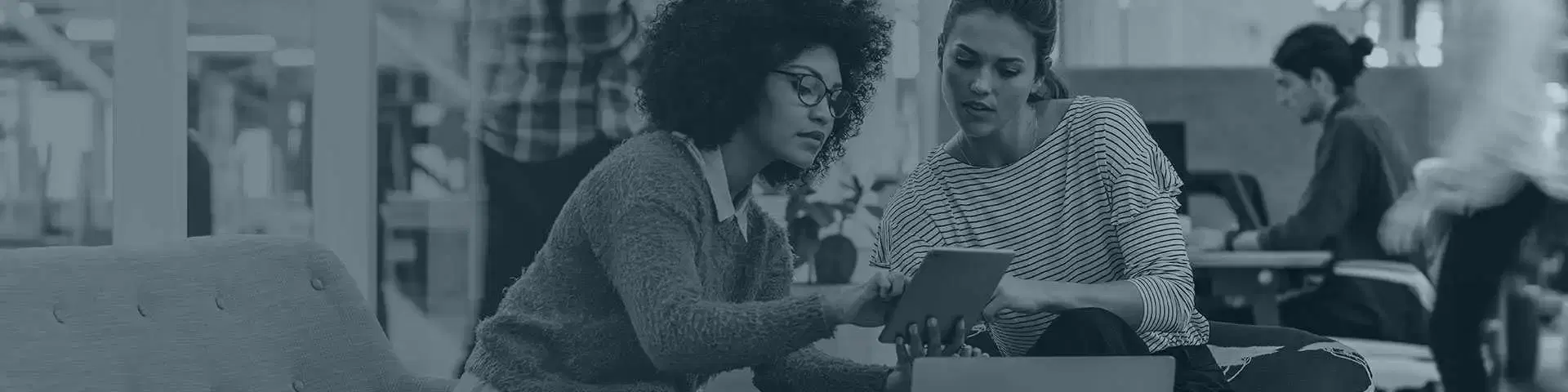 Students looking at tablet